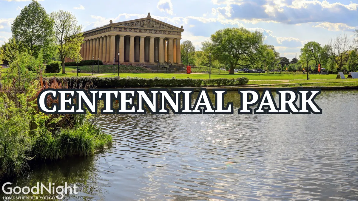 This image features the iconic Parthenon within Centennial Park, surrounded by lush greenery and a reflective body of water. The tranquil scene captures visitors enjoying the outdoors, with open spaces for family activities and picnics.